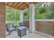 Cozy outdoor patio featuring comfortable seating and a stylish fire pit table at 100 Canal Rd, Saint George, SC 29477