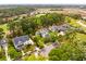 Aerial view of a residential neighborhood with beautiful homes, lush greenery, and waterfront access at 11 Dalton St, Daniel Island, SC 29492