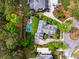 Aerial view of a house with a beautiful backyard featuring a pool, seating area and landscaping at 11 Dalton St, Daniel Island, SC 29492