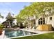 Lush backyard features a sparkling pool with sun loungers, creating a perfect outdoor entertainment space at 11 Dalton St, Daniel Island, SC 29492