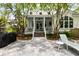 Relaxing backyard patio with a grill and lounge chair, perfect for outdoor enjoyment at 11 Dalton St, Daniel Island, SC 29492