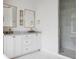 Bright bathroom featuring white cabinetry, marble countertop, double sinks, and shower at 11 Dalton St, Daniel Island, SC 29492