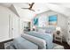Bright bedroom boasts a large closet and coordinating decor in neutral and blue tones at 11 Dalton St, Daniel Island, SC 29492