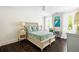 Comfortable bedroom with queen bed, natural light, and heron painting at 11 Dalton St, Daniel Island, SC 29492
