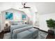 A beautifully furnished bedroom with neutral tones and coordinated blue accents at 11 Dalton St, Daniel Island, SC 29492