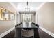 Long and narrow dining room with a long dark wood table and many chairs at 11 Dalton St, Daniel Island, SC 29492