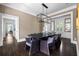 An open dining room with a dark wood table and views to other rooms at 11 Dalton St, Daniel Island, SC 29492