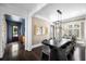An open dining room with a dark wood table and views to other rooms at 11 Dalton St, Daniel Island, SC 29492