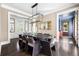 Elegant dining room featuring a modern chandelier and large dining table with seating for eight at 11 Dalton St, Daniel Island, SC 29492