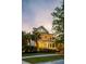 Welcoming two-story home featuring double porches, wreaths on doors, and exterior lights at 11 Dalton St, Daniel Island, SC 29492