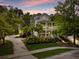 Elegant two-story home with double porches, mature landscaping, and a spacious driveway at 11 Dalton St, Daniel Island, SC 29492