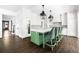 Elegant kitchen with white cabinets, a large island, and bar stool seating at 11 Dalton St, Daniel Island, SC 29492