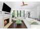 Living room with a fireplace and a large sectional couch at 11 Dalton St, Daniel Island, SC 29492