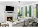 Living room with a fireplace and a large sectional couch at 11 Dalton St, Daniel Island, SC 29492