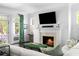 Living room with a fireplace and a large sectional couch at 11 Dalton St, Daniel Island, SC 29492