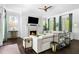 Spacious living room with a fireplace, large windows, and a comfortable sectional sofa with stylish decor at 11 Dalton St, Daniel Island, SC 29492