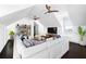 Bright living room featuring white walls, ceiling fans, dark wood floors, and a comfortable white sectional sofa at 11 Dalton St, Daniel Island, SC 29492