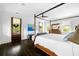 Serene bedroom featuring a canopy bed, light filled windows, and a private outdoor entry at 11 Dalton St, Daniel Island, SC 29492