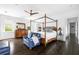 Bedroom with a canopy bed, dresser and stylish blue accents, creating a calming retreat at 11 Dalton St, Daniel Island, SC 29492