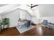Bright home office features hardwood floors, an area rug, and a blue-topped desk at 11 Dalton St, Daniel Island, SC 29492