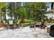 Cozy stone patio with outdoor seating and a fire pit, perfect for entertaining at 11 Dalton St, Daniel Island, SC 29492