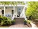Inviting front porch with classic architectural details and beautiful landscaping at 11 Dalton St, Daniel Island, SC 29492