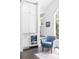 A cozy sitting area features built-in cabinets, a beverage refrigerator, and a large window with a view of the backyard at 11 Dalton St, Daniel Island, SC 29492