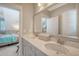 Bathroom featuring double sinks, quartz countertop, and neutral colored walls at 1141 Hills Plantation Dr, Charleston, SC 29412