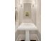 Charming powder room with pedestal sink, decorative mirror and wall sconces at 1141 Hills Plantation Dr, Charleston, SC 29412