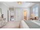 Bright bedroom with carpeted floors and ensuite access to the bathroom at 1141 Hills Plantation Dr, Charleston, SC 29412