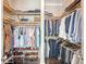 Spacious walk-in closet featuring custom shelving and racks for clothing and shoes at 1141 Hills Plantation Dr, Charleston, SC 29412