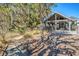 Community area offers a serene walkway shaded by trees, leading to the community area with picnic tables and fire place at 1141 Hills Plantation Dr, Charleston, SC 29412