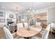 Bright dining room with hardwood floors and views into living room and kitchen at 1141 Hills Plantation Dr, Charleston, SC 29412