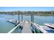 View along the dock with a boat, clear water, and boat lift at 1141 Hills Plantation Dr, Charleston, SC 29412