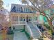 Charming home featuring a welcoming porch, multiple dormers and ground floor garage at 1141 Hills Plantation Dr, Charleston, SC 29412