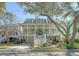 Inviting two-story home featuring a charming porch, well-manicured landscaping, and a convenient garage at 1141 Hills Plantation Dr, Charleston, SC 29412