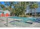 Enjoy a refreshing community pool and hot tub featuring lush landscaping, and lounge chairs for relaxation at 1141 Hills Plantation Dr, Charleston, SC 29412