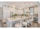 Bright modern kitchen with a large island, pendant lighting and stainless appliances at 1141 Hills Plantation Dr, Charleston, SC 29412