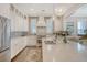 A modern kitchen features white cabinets, gray subway tile backsplash, stainless appliances and quartz counters at 1141 Hills Plantation Dr, Charleston, SC 29412