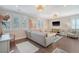 Cozy living room featuring a sectional sofa, hardwood floors, and natural light at 1141 Hills Plantation Dr, Charleston, SC 29412