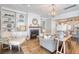 Comfortable living room with fireplace, built-in shelves, neutral furniture, and an area rug on hardwood floors at 1141 Hills Plantation Dr, Charleston, SC 29412