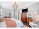 Well-appointed main bedroom showcasing stylish furnishings, a mounted TV, and tasteful decor at 1141 Hills Plantation Dr, Charleston, SC 29412