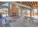 Relaxing community gathering area featuring an outdoor fireplace and picnic tables at 1141 Hills Plantation Dr, Charleston, SC 29412
