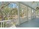 Covered porch with views of landscaped yard at 1141 Hills Plantation Dr, Charleston, SC 29412