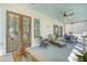Inviting screened porch with comfortable seating and outdoor dining area at 1141 Hills Plantation Dr, Charleston, SC 29412