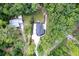 Aerial view of a private home with lush greenery, a long driveway and a spacious backyard at 128 Paul Dr, Summerville, SC 29483