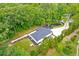 Aerial shot of house and surrounding trees, showing a spacious yard and landscaping at 128 Paul Dr, Summerville, SC 29483