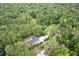Aerial view of the home nestled among lush greenery showcasing the surrounding landscape and neighborhood at 128 Paul Dr, Summerville, SC 29483