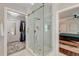 Bathroom featuring a glass shower with gold accents and a view into a walk-in closet and bedroom at 128 Paul Dr, Summerville, SC 29483