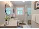 Neutral bathroom featuring a glass shower, modern fixtures, and a wood-look tile floor at 128 Paul Dr, Summerville, SC 29483